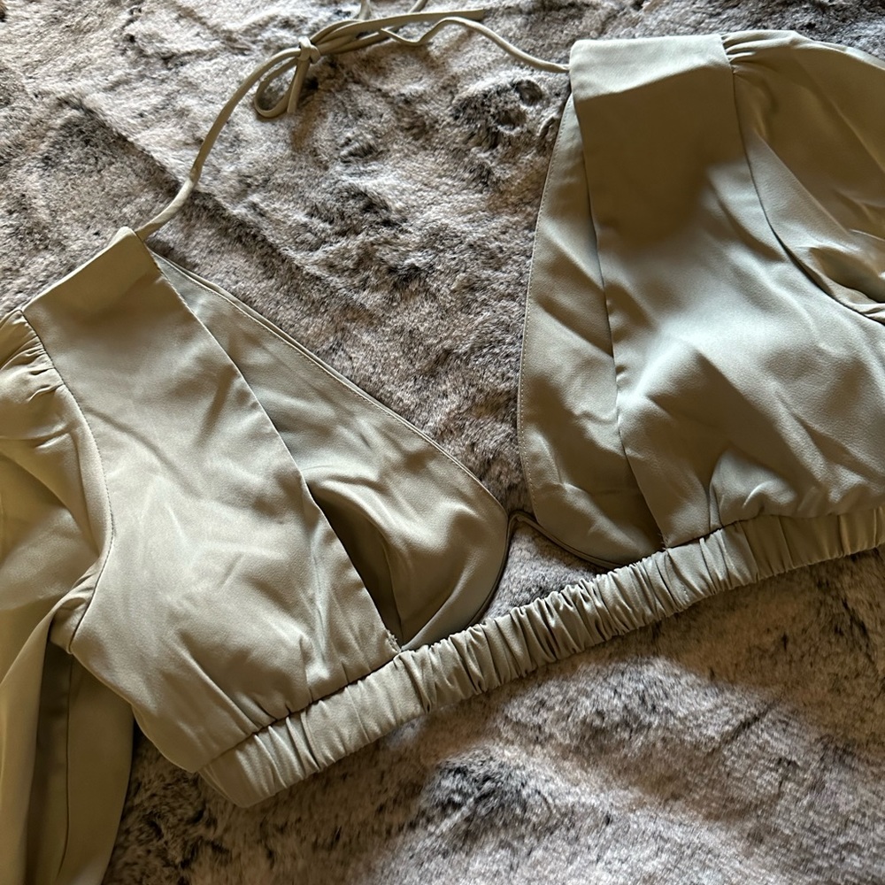 Sage green satin top. Wrist ties. Flared sleeves. Brand new.